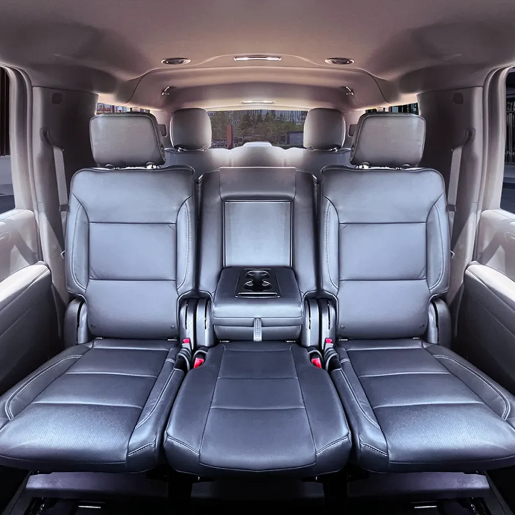 SUV-Suburban second row leather chairs with center console.