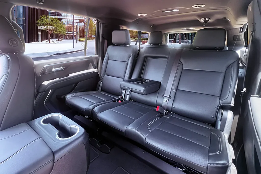 SUV-Suburban third row leather bench seat with fold-down armrest.