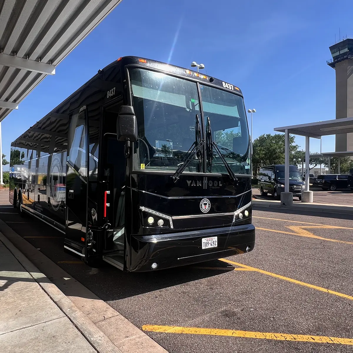 ECHO East Coast Transportation motorcoach parked at an airport.