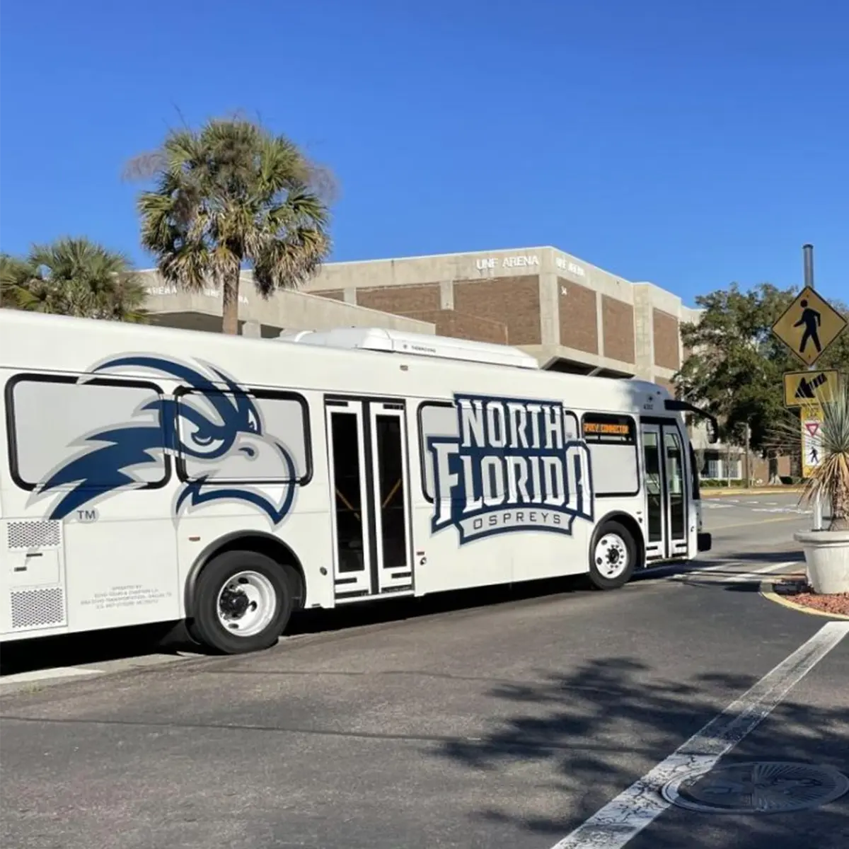 UNF Ospreys shuttle bus on campus near the UNF Arena.